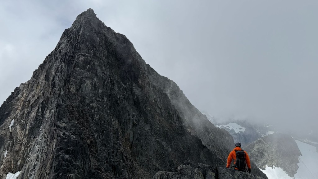 Scrambling along the exposed ridge of the Armchair Traverse between Mount Cook and Mount Weart