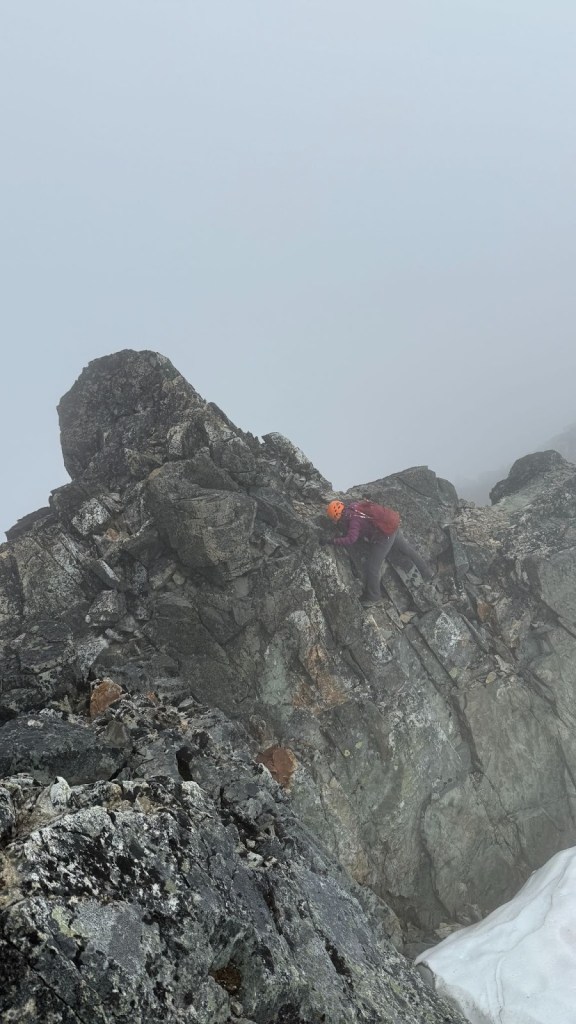 Scrambling along the exposed ridge of the Armchair Traverse between Mount Cook and Mount Weart