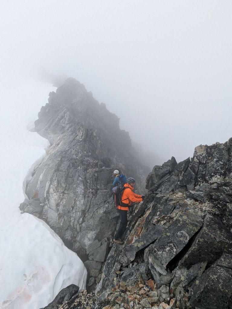 Scrambling along the exposed ridge of the Armchair Traverse between Mount Cook and Mount Weart