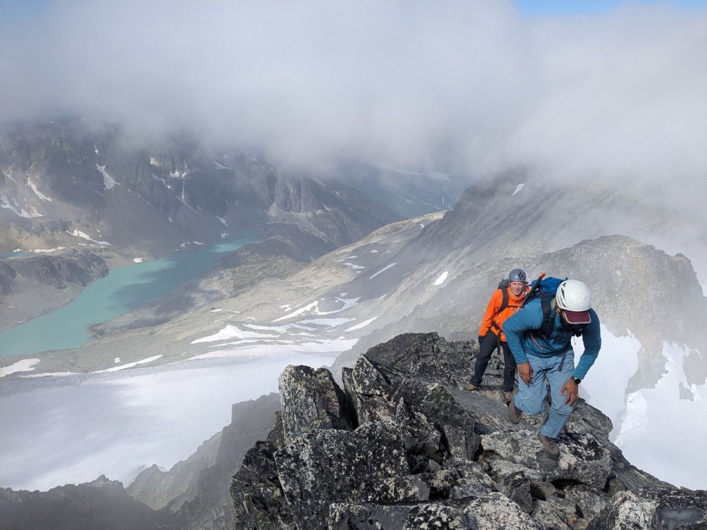 Scrambling along the exposed ridge of the Armchair Traverse between Mount Cook and Mount Weart