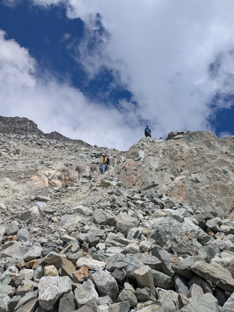 Navigating unstable scree slopes on the descent from Mount Weart