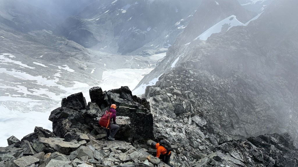 Scrambling along the exposed ridge of the Armchair Traverse between Mount Cook and Mount Weart