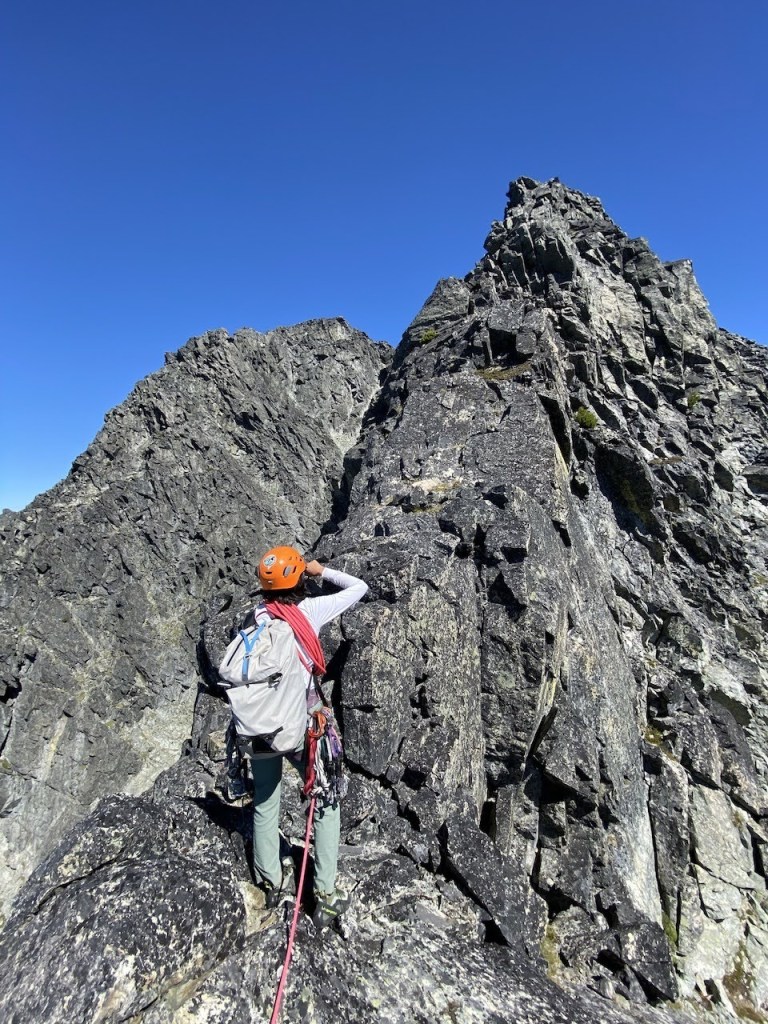 Leading on the DOA Buttress alpine rock route on Blackcomb Peak